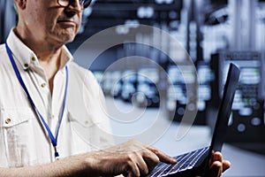 Computer scientist examining servers