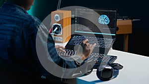 Computer scientist at home updating artificial intelligence neural networks