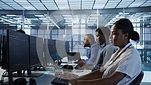 Computer scientists in data center implementing AI systems
