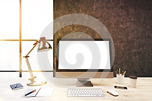 Computer screen, dark concrete wall, toned