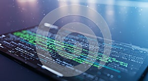 Computer screen displaying lines of code, with syntax highlighting in green and white on