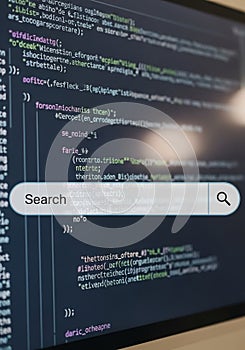 Computer screen displays lines of programming code in various colors, indicating