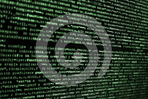 Computer screen with HTML code in green over bkack background..