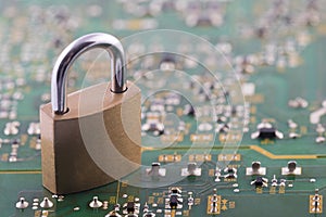 Computer security concept. Padlock on computer circuit board
