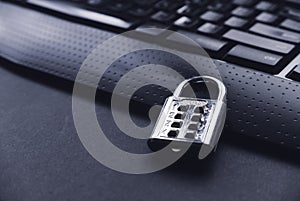 Computer security concept. A padlock on a computer keyboard