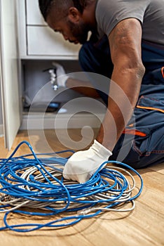 Computer service worker holding tangle of network cables