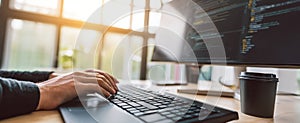 The computer setup with hands typing on keyboard and coding on the screen..AI generated image