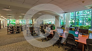 Computer station at the university library timelapse hyperlapse with seating area in the foreground.