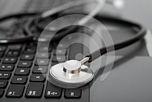 Computer with stethoscope on it