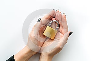 Computer system protection from hacker with locker in hands on white background top view