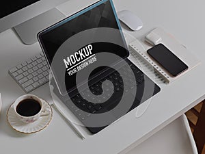 Computer table with digital tablet, smartphone, accessories and coffee cup, clipping path