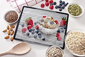 Computer Tablet Cereal Berries Nuts Grains Breakfast