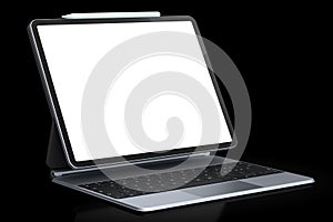 Computer tablet with keyboard and blank screen isolated on black background.