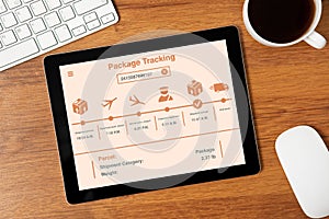 Computer tablet on table with app package tracking on screen