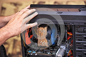 Computer Technician Assembles A Computer. photo