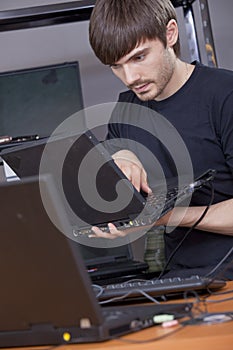 Computer technician installing software