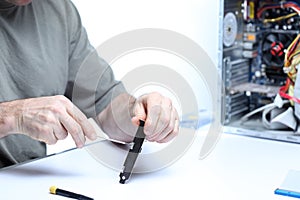 Computer technician is repairing