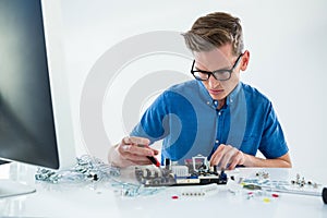 Computer technician repairing motherboard