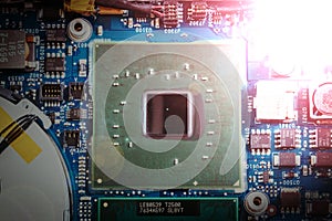 Computer Technology: Close up of a computer chip on a circuit board. Light effect