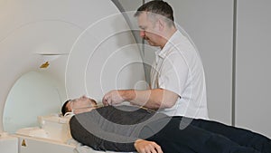 Computer tomography concept. Health concept. Person gets scanned by magnetic resonance imaging scanner in modern