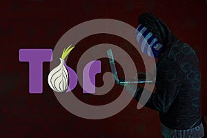 Computer with the tor logo. Tor is the acronym
