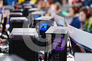 Computer towers for gaming. Professional gamers in the background