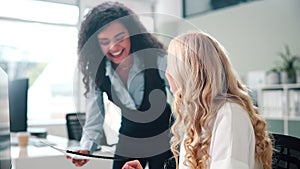 Computer, training and woman with intern in office, business people and talking to trainee. Workplace, designer and