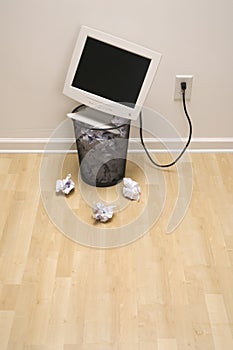 Computer in trash can.
