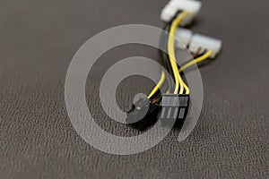 Computer wire black and yellow on gray background close up