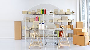 Computer on wooden working table with package product box delivery background in room in apartment indoor with copy free space.