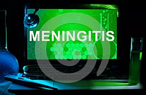 Computer with words Meningitis. photo