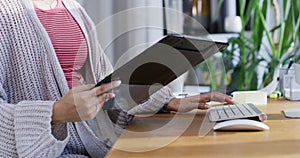 Computer, work and internet research of business woman multitask with clipboard and keyboard typing. Office contact us