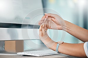 Computer, working and woman stretching fingers for carpal tunnel, muscle health or tendinitis self care in office job photo