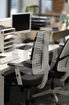 Computer workstation with white office chairs