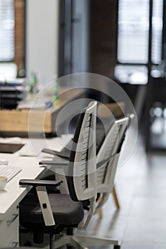 Computer workstation with white office chairs