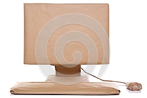 Computer wrapped in brown paper
