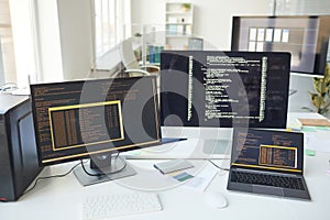 Computers with Code on Screen in IT Development Office