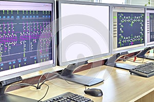 Computers and monitors with schematic diagram for supervisory, control and data acquisition