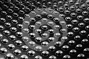 Concave metal surface background with holes photo