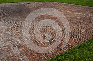 Concave red brick platform photo