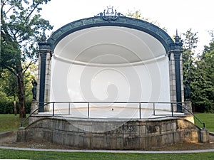 concave stage with white wall in the garden of the crystal palace in the city of Porto.