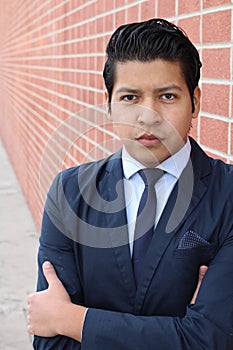 Conceited elegant Hispanic businessman close up photo