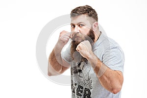 Concentraited man standing in boxer position and ready to fight