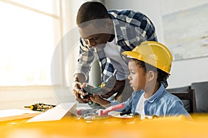 Concentrated african american father and son