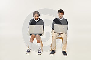 concentrated african american schoolkids in uniform