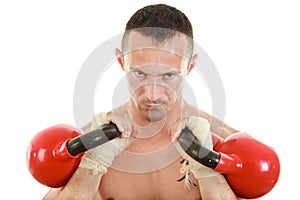 Concentrated athletic man holding red kettlebells weights lifted