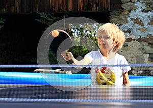 Little girl playing ping-pong