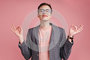 Concentrated boy make meditate calm gesture