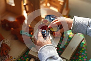 Concentrated boy puts colorful coins during ABA