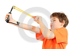 Concentrated boy with slingshot aim photo